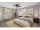 Serene primary bedroom featuring neutral tones, natural light, and modern furnishings at 8732 W Arbor Ave, Littleton, CO 80123