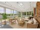 Bright sunroom with skylight and multiple windows offering tranquil views and abundant natural light at 8732 W Arbor Ave, Littleton, CO 80123