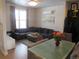 Living room showcasing a gray sectional sofa, modern decor, and open layout at 6850 E Archer Dr, Denver, CO 80230