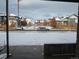 View of the neighborhood with modern homes and snow-covered front yards at 6850 E Archer Dr, Denver, CO 80230