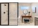 This bathroom offers a black-framed shower and a vanity with a make-up mirror at 12784 Bend Ct, Firestone, CO 80504