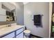Bathroom features neutral walls, and sleek fixtures with a dragon shower curtain at 9672 W Chatfield Ave # C, Littleton, CO 80128