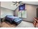 Vaulted ceiling bedroom featuring a ceiling fan, and a large picturesque window at 9672 W Chatfield Ave # C, Littleton, CO 80128