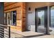 Modern front entrance with wood and gray siding, and a black door at 1024 5Th St, Golden, CO 80403