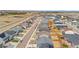 An aerial perspective showcasing a residential street lined with well-kept homes in a planned community at 114 S Edge Cliff St, Castle Rock, CO 80104
