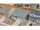 High-angle view of a house with gray siding and a gray roof surrounded by neighboring homes at 114 S Edge Cliff St, Castle Rock, CO 80104