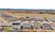 Wide aerial shot of a suburban neighborhood with many single Gathering homes in a planned community at 114 S Edge Cliff St, Castle Rock, CO 80104