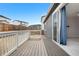 Deck overlooking backyard with lawn and fencing, next to door at 114 S Edge Cliff St, Castle Rock, CO 80104