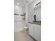 Bathroom featuring a shower, neutral tile, and modern vanity at 114 S Edge Cliff St, Castle Rock, CO 80104