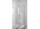 Modern bathroom with frameless glass shower door and white subway tile at 114 S Edge Cliff St, Castle Rock, CO 80104