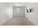 A serene bedroom with large windows and plush carpeting at 114 S Edge Cliff St, Castle Rock, CO 80104