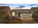 Charming single-Gathering home with a well-maintained front yard and attached two-car garage at 114 S Edge Cliff St, Castle Rock, CO 80104