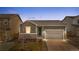 Charming single-story home with a gray exterior, stone accents, and a well-maintained front yard at 114 S Edge Cliff St, Castle Rock, CO 80104