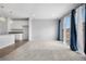 A spacious living room with access to an outdoor balcony at 114 S Edge Cliff St, Castle Rock, CO 80104