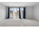 A spacious living room with access to an outdoor balcony at 114 S Edge Cliff St, Castle Rock, CO 80104