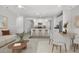 Bright, open-concept living space with modern furniture and a view of the kitchen at 114 S Edge Cliff St, Castle Rock, CO 80104
