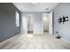 Light-filled main bedroom with carpeted floors, windows, and access to the main bathroom at 114 S Edge Cliff St, Castle Rock, CO 80104