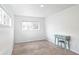Bright bedroom features neutral carpet, white walls, and ample natural light at 1213 Jamaica St, Aurora, CO 80010