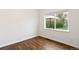 Bright bedroom with natural light and hardwood floors at 1213 Jamaica St, Aurora, CO 80010
