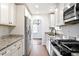Modern kitchen features stainless steel appliances and granite countertops at 1213 Jamaica St, Aurora, CO 80010