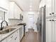 Well-equipped kitchen features stainless steel appliances, granite counters, and ample cabinet space at 1213 Jamaica St, Aurora, CO 80010