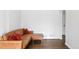 Spacious living room features hardwood floors and stylish leather sofa at 1213 Jamaica St, Aurora, CO 80010