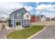Backyard featuring a well-maintained lawn, patio area, fence, and beautiful landscaping at 4444 N Picadilly Ct, Aurora, CO 80019