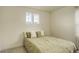 Bedroom with a window, soft carpet, neutral walls, and a queen-size bed with decorative pillows at 4444 N Picadilly Ct, Aurora, CO 80019