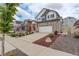 Beautiful home featuring a stone facade, two-car garage, and well-manicured front yard at 4444 N Picadilly Ct, Aurora, CO 80019