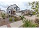 Charming home exterior featuring a two-car garage and tasteful landscaping at 4444 N Picadilly Ct, Aurora, CO 80019