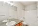 Well-lit bathroom features a shower and tub combo, and granite counters at 1495 Blue Sky Way # 9-308, Erie, CO 80516