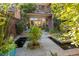 Backyard features a serene pond, lush greenery, and a private outdoor space at 2826 Broadway St # 106, Boulder, CO 80304