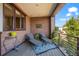 Relaxing balcony featuring comfortable lounge seating and views of lush greenery at 2826 Broadway St # 106, Boulder, CO 80304