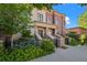 Beautiful exterior of townhouse with manicured landscaping and stone accents at 2826 Broadway St # 106, Boulder, CO 80304