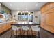 Stylish kitchen island with breakfast bar and modern pendant lighting at 2826 Broadway St # 106, Boulder, CO 80304
