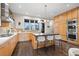 Modern kitchen featuring a spacious island with bar seating, stainless steel appliances, and custom cabinets at 2826 Broadway St # 106, Boulder, CO 80304