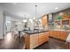 Open kitchen with large island, modern appliances and stylish chandelier at 2826 Broadway St # 106, Boulder, CO 80304