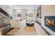 Bright living room featuring modern fireplace and cozy furniture at 2826 Broadway St # 106, Boulder, CO 80304