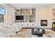 Inviting living room with built-in shelving, modern fireplace, and comfortable seating at 2826 Broadway St # 106, Boulder, CO 80304