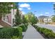 Attractive street view of townhomes, with sidewalks and well-maintained landscaping at 2826 Broadway St # 106, Boulder, CO 80304