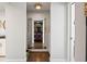 Hallway shot of a walk-in closet providing ample storage with custom shelving and shoe storage at 2826 Broadway St # 106, Boulder, CO 80304