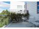 Outdoor balcony space with seating, privacy greenery, and a view of the neighborhood at 8774 Martin Luther King Blvd, Denver, CO 80238