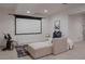 Finished basement with projector screen, comfy seating, and stylish décor at 8774 Martin Luther King Blvd, Denver, CO 80238