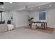 Finished basement with a projector screen, home office space, and comfy seating at 8774 Martin Luther King Blvd, Denver, CO 80238