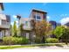 Stunning modern home featuring a two-story design, balcony, professional landscaping, and neutral color palette at 8774 Martin Luther King Blvd, Denver, CO 80238