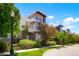 Well maintained two-story home with professional landscaping, a sidewalk, and a street lamp at 8774 Martin Luther King Blvd, Denver, CO 80238