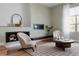Bright living area with modern decor, featuring hardwood floors, fireplace, and a full window view at 8774 Martin Luther King Blvd, Denver, CO 80238