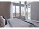 Bright main bedroom featuring large windows, neutral decor, and access to an outdoor space for fresh air at 8774 Martin Luther King Blvd, Denver, CO 80238
