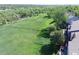 Aerial shot showcases townhomes surrounded by lush greenery, tree coverage, and a beautiful landscape at 9771 W Cornell Pl, Lakewood, CO 80227