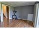 Finished basement space with exercise equipment, grey walls, and access to yard at 9771 W Cornell Pl, Lakewood, CO 80227